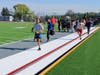 Students take their first steps onto the new field at Washington Irving School, marking the start of a space they’ll use each day for learning, play, and connection.