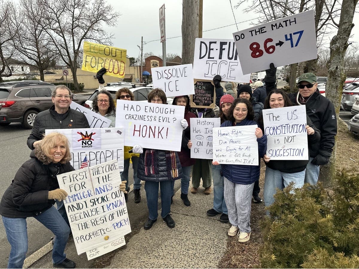 Brenner and participants at a past rally in support of anti-ICE movements.