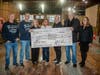 DeRiggi-Whitton and Mayor Pam Panzenbeck presented the check to the North Shore Theater.