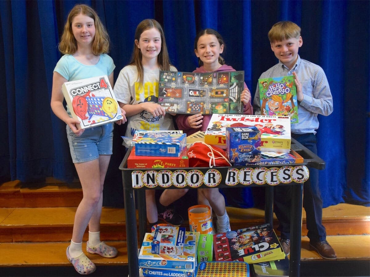 John G. Dinkelmeyer Elementary School students, from left, Katie Bulger, Briana Sheehan, Gianna Santos, and Nicholas Racanelli showed off the indoor recess cart that now has more games.