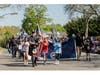Former principal Mr. Healy led the parade in traditional dress, playing the
bagpipes.