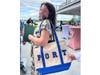 Councilwoman Mariann Dalimonte showed off her Spectrum Designs tote bag.