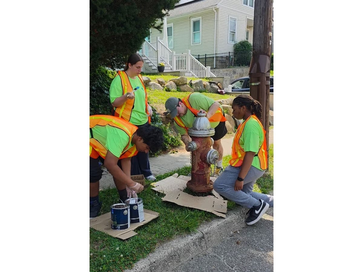 Pictured from left: Hadee Jaffar, Emily Rios, Mykael Pajuelo, and Aaleyah Lomini painting a hydrant on Gervais Street.