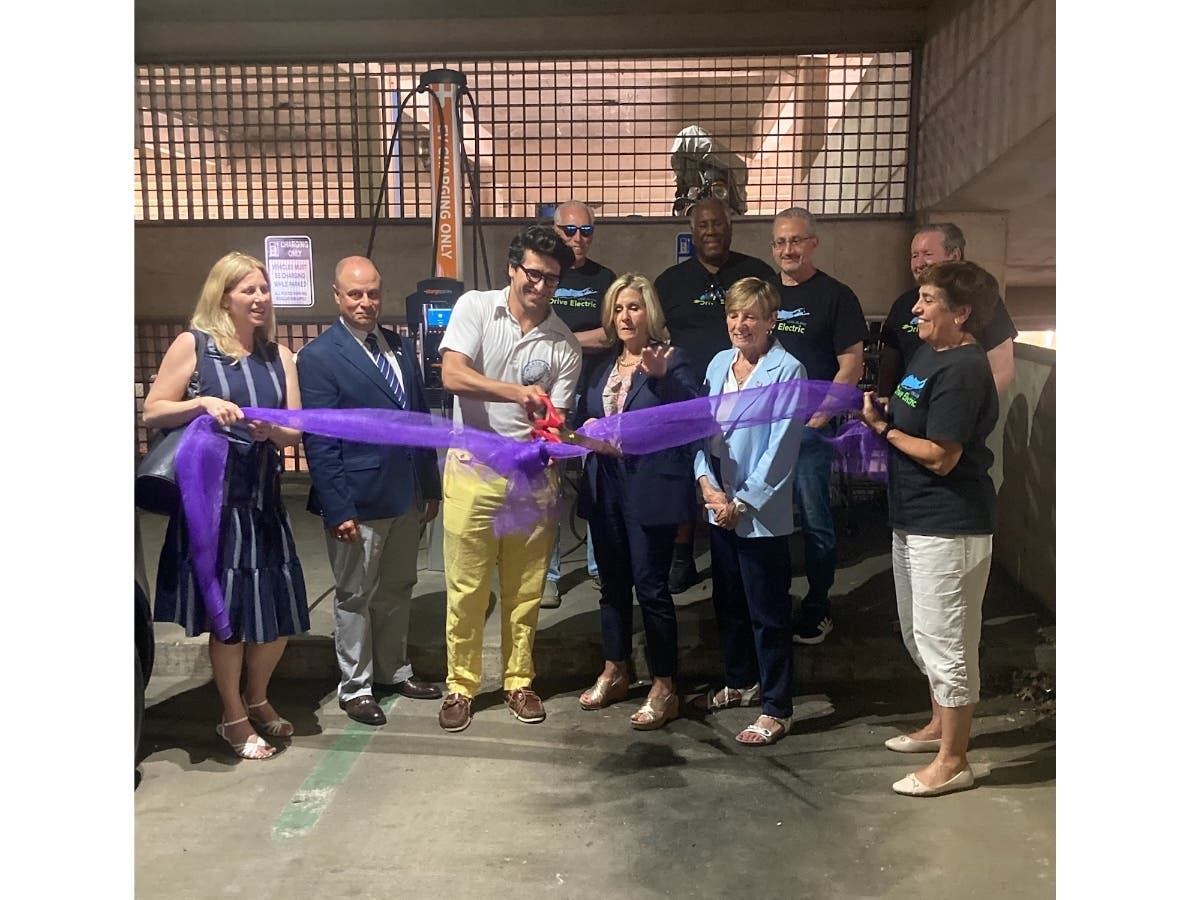 Mayor Pamela Panzenbeck, City officials, representatives from Drive Electric Long Island, and community members celebrate the new installation.