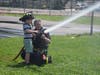 Members of the East Meadow Fire Department demonstrated how to use a firefighter hose with students at Bowling Green Elementary School.