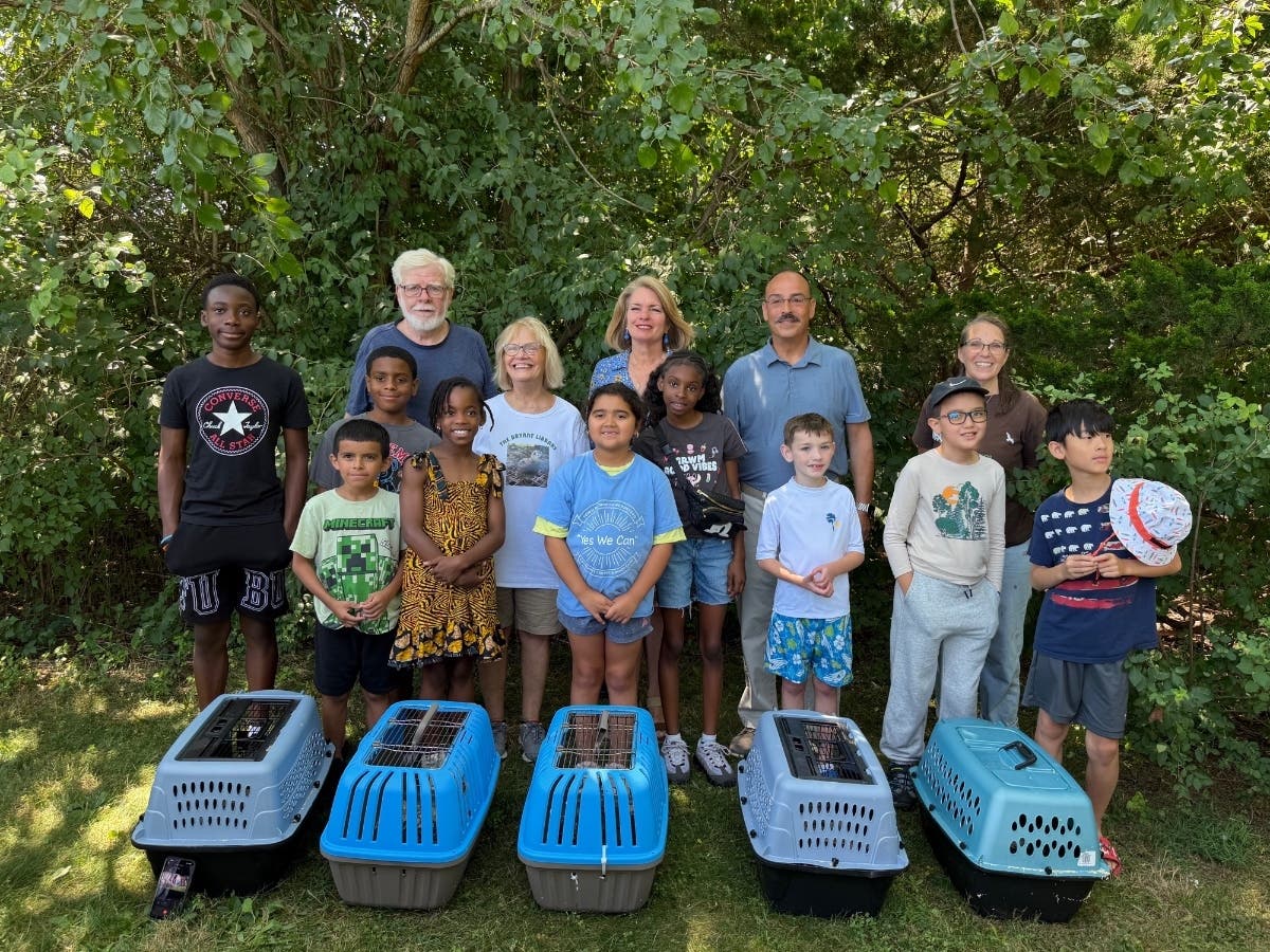 Local officials, volunteers, and children gathered to bid the quail a fond farewell before their release into the Hempstead Harbor Shoreline Trail.