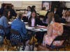 New staff met one another during the annual orientation.