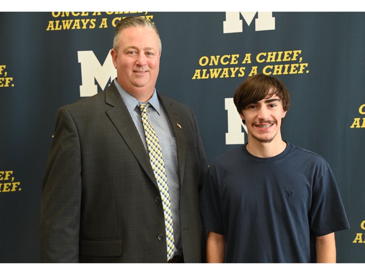 Massapequa Superintendent Dr. William Brennan congratulates 2027 National Merit Scholarship Program semifinalist David “DJ” Moravec on his academic achievement.