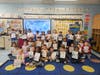 Kindergartners in Jodi Rebholz’s and Erica Castaldo’s classes in the North Babylon School District proudly display their work after taking part in a hands-on weather experiment exploring how clouds form and produce rain.