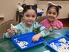 Prekindergarten students participate in a winter-themed “snowball” tossing activity that encouraged movement, teamwork, and hand-eye coordination at Marion G. Vedder Elementary School.