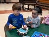 Students proudly display their marshmallow-and-toothpick snowflake creations during a STEM-based activity at Marion G. Vedder Elementary School’s snowflake celebration.