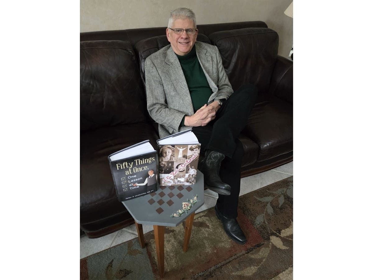 Smithtown resident and author Peter Chidichimo is pictured with his books E la Storia Continua and Fifty Things at Once, One Lesson at a Time, which explore family history, Italian immigration, and life lessons shaped by faith and perseverance.