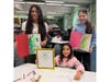 Students proudly display their monster illustrations created during the cross-grade art collaboration between Daniel Street Elementary and Lindenhurst Middle School.