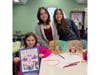 Students from both schools gather to showcase completed monster artwork during a January meet-up at Lindenhurst Middle School.