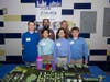Sayville Middle School students display their future city model during the Future City Competition in New York City, where teams designed innovative urban environments set 100 years in the future.