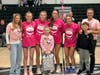 The Harborfields girls varsity team welcomed honorary captain Belle during their Coaches vs. Cancer night on Jan. 27.