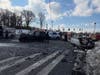Emergency responders from multiple agencies operate at the scene of an overturned crash that closed Route 347 and Route 111 in Smithtown.