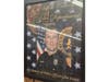 Framed memorial portrait of Suffolk County Police Officer Glen Ciano displayed indoors with department insignia in the background.