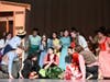 Students gather around a dramatic onstage moment during the musical comedy “Curtains.”