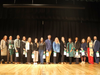 Harborfields educators, students and community members gather on stage to honor retiring educator Jeff Shade during the district’s annual Black History celebration.