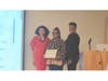 Huntington Tax Receiver Jillian Guthman presents Dr. Georgette Grier-Key with a certificate of recognition.