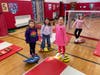 Timber Point Elementary School students participate in Olympic-themed activities during physical education class.