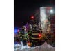 Members of the West Babylon Fire Department connect hoses as crews respond to a 7:29 p.m. structure fire at Fairfield Suburbia Gardens. Snow and ice made access difficult, officials said.