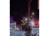 A firefighter carries a cat to safety during the response to a working fire at Fairfield Suburbia Gardens in West Babylon.