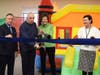 Alan and Ellen Spiegel (center), alongside Rob Ciatto (left), President/CEO of ACLD, and Stacey Ratner (right), Principal of ACLD’s Children’s Services, celebrate the donation of new portable gym equipment during a ribbon-cutting ceremony in Bay Shore.