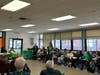 Seniors gather and participate in St. Patrick’s Day festivities during the Irish Soda Bread Contest at the Huntington Senior Center.