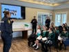 Public safety officials demonstrated procedures and responsibilities to Girl Scouts during an educational session at Smithtown Town Hall.