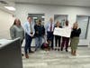 Officials gathered for a check presentation to Paws of War in Bohemia.