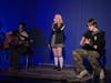Sayville High School students perform during an open mic segment at the school’s annual Art Night, showcasing musical talent alongside visual arts.