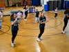 Elementary students learn an upbeat routine from members of the high school dance team during a social-emotional learning session.