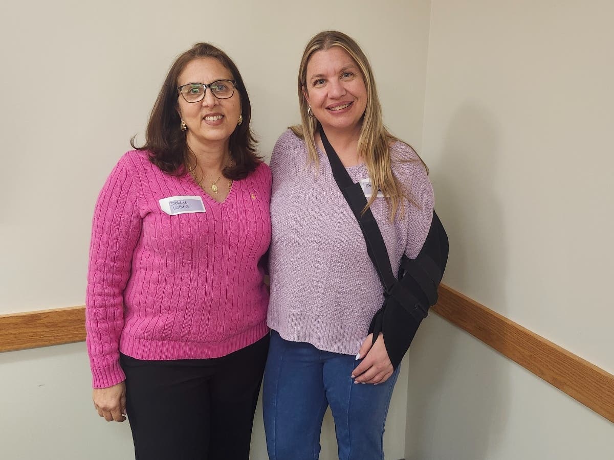 Debbie Weiss, left, and Christine Smith, both of Huntington, shared their cancer journeys and the importance of support and community at a Huntington Hospital wellness event for patients and caregivers.