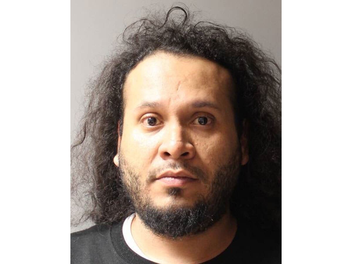 Rodolfo Alvarez pleaded guilty to attempted murder after prosecutors said he stabbed and strangled his wife while she slept inside their Central Islip home.