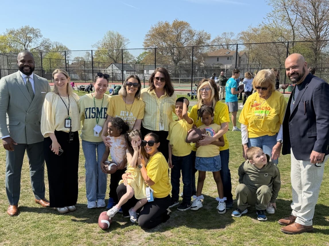 Tristan Massalay-Ellis, Manager of Strategic Partnerships at Verra Mobility (left), and Dr. Matthew Boccanfuso, Principal of Lindenhurst High School (right), are pictured at the start of the event, joining students and faculty.