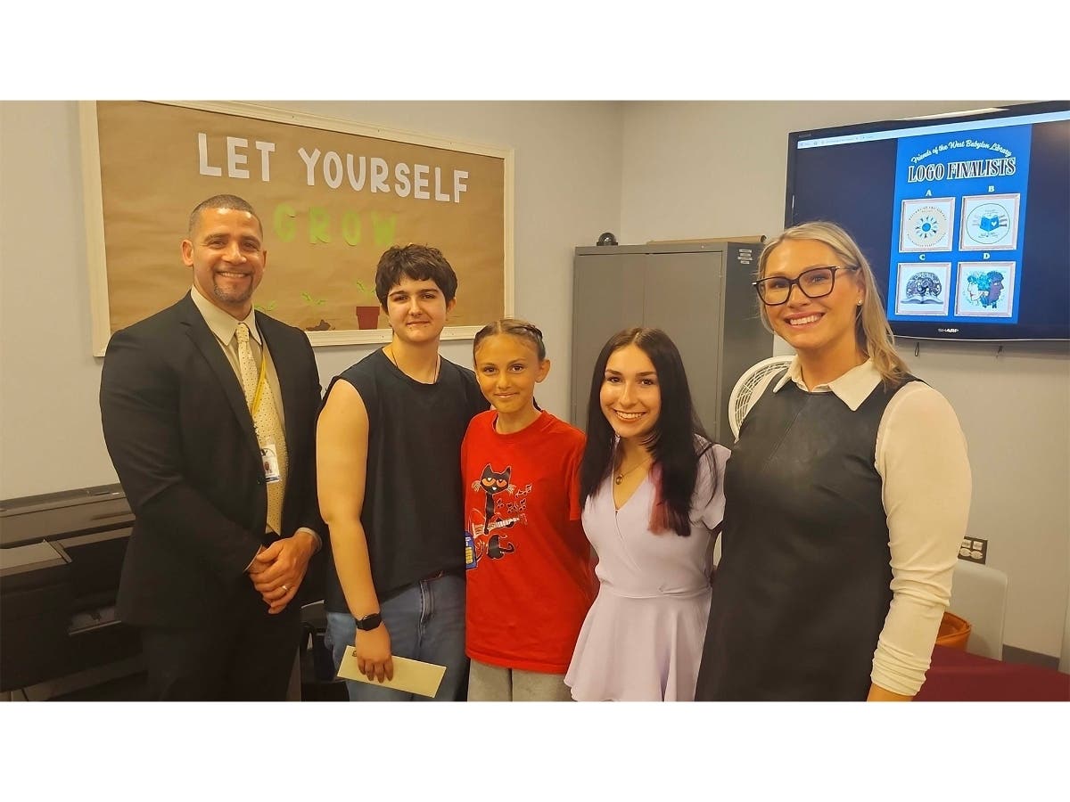 West Babylon Junior High School Principal Dr. Carlos Falcon, Remy Bova, Kara Peretti, Allyson Powers, and Youth Services Coordinator Carisse Mitchell
