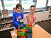 Students work together to design a “rebel base” using Magna-Tiles as part of a Star Wars-themed STEM challenge led by librarian Meghan Dyckova.