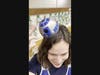 Library media specialist Meghan Dyckova gets into the spirit of Star Wars Day with a playful R2-D2-themed headpiece while leading activities on May 4.