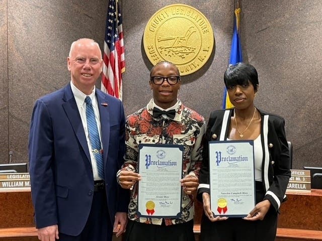 Suffolk County Legislator Tom Donnelly honored Melville residents Jovani Moss and
Natechia Campbell-Moss at the April 21 General Meeting of the Suffolk County Legislature
in Hauppauge for their heroic actions during a March house fire.