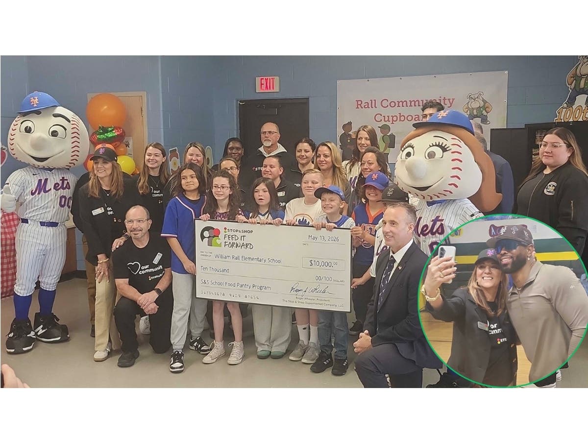 Community members, students, and Stop & Shop representatives celebrate the opening of the new food pantry at William Rall Elementary School alongside Mr. and Mrs. Met.