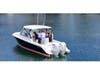 Jeff and Ryan Strong and Amanda & Matthew Barbara gather aboard a Pursuit boat as Strong’s Marine announces its partnership with SS3 Marina in Lindenhurst.