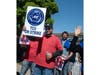 Union members picketed near Babylon station on Saturday after Long Island Rail Road workers officially went on strike.