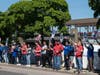 Picketing workers gather near Babylon station Saturday as LIRR service remained suspended across Long Island.