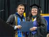 Hunter Rindos receives the Kingdon Gould Jr. Award from Georgian Court University Associate Provost Dr. Sharmay Woods.