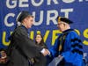  Hunter Rindos accepts his degree from Georgian Court University, Interim President Dr. Eugene J. Cornacchia