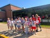 Students at Sunrise Drive Elementary School display handmade thank-you signs honoring local first responders during the Sayville school’s annual parade.