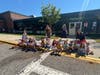 Sunrise Drive Elementary School students hold American flags and thank-you cards while cheering on local first responders during the annual parade.
