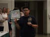 Benyamin Garcia Gomez displays his certificate and trophy after being recognized during the 20th Annual All-Star Awards ceremony.